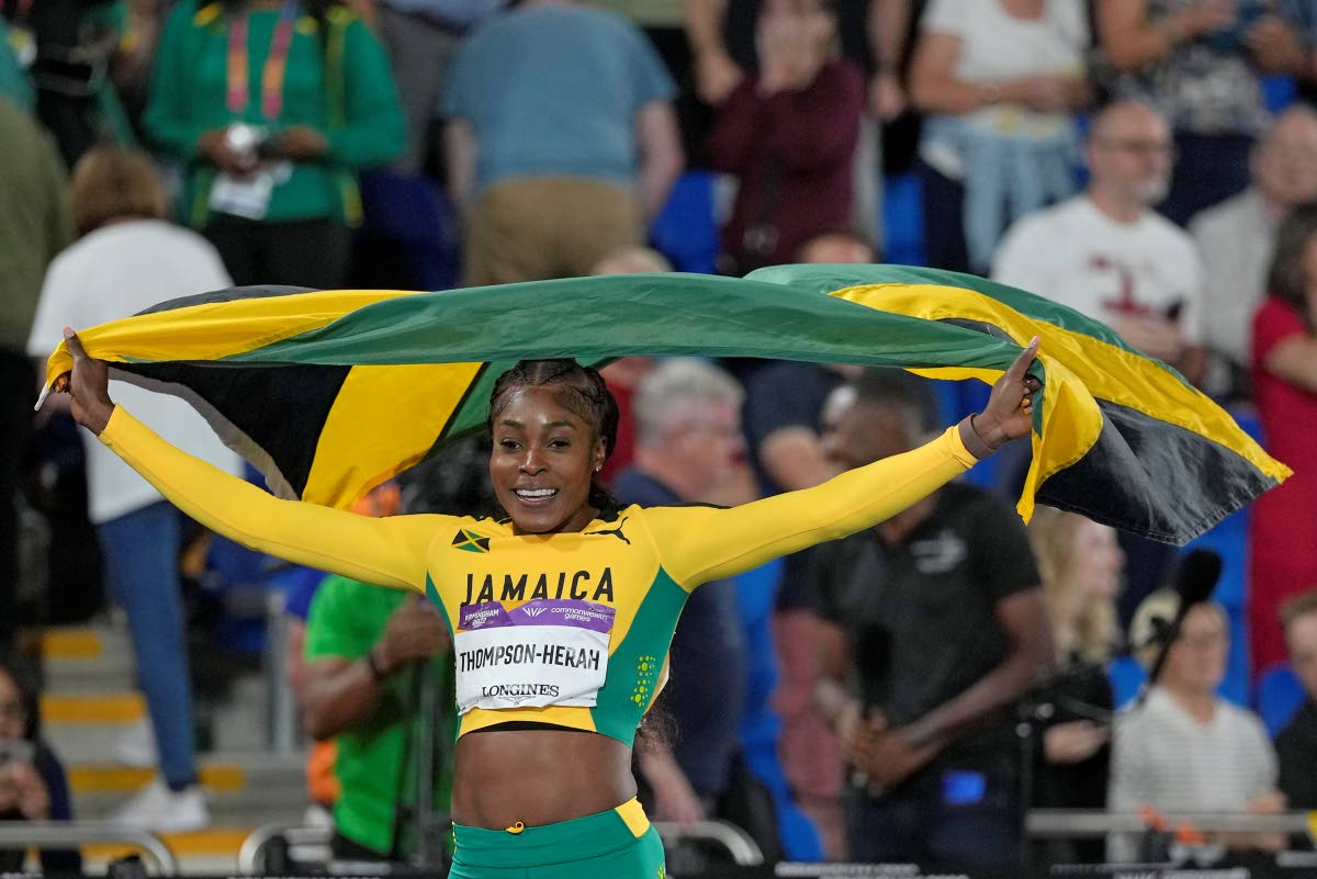 Elaine Thompson-Herah celebrates after winning the gold medal in the women’s 100m final during the athletics in the Alexander Stadium at the Commonwealth Games in Birmingham, England, in August 2022.
