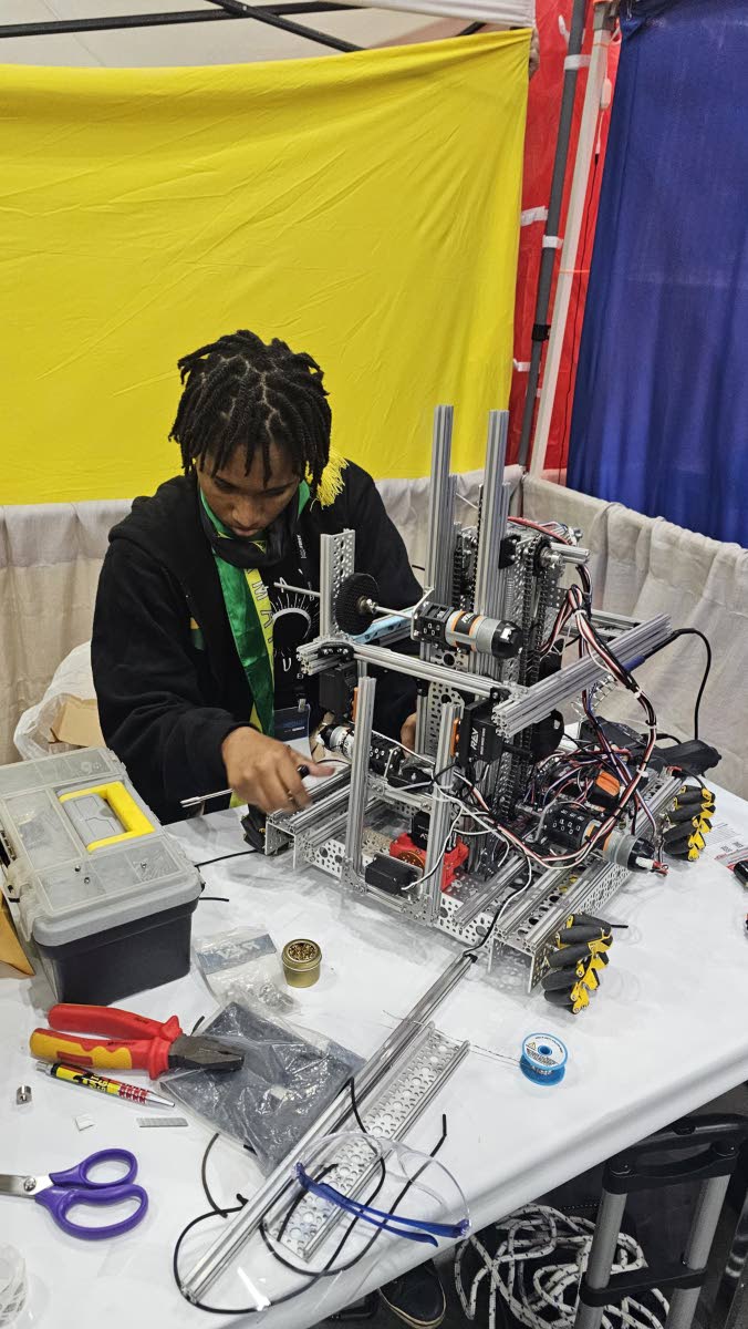 Kerr, responsible for documentation and outreach duties for the Campion College Crimson Crocs robotics team, inspected the mechanical abilities of the team’s bot during the FIRST Tech Robotics Competition in Texas back in April.