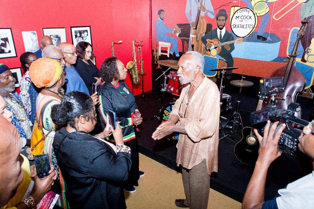 Jamaica Music Museum Director/Curator Herbie Miller addressing patrons, including Minister of Culture, Gender, Entertainment and Sport Olivia Grange, at the opening of the exhibition, ‘From African to Jamaican: Music and Creolized Black Culture’, insid