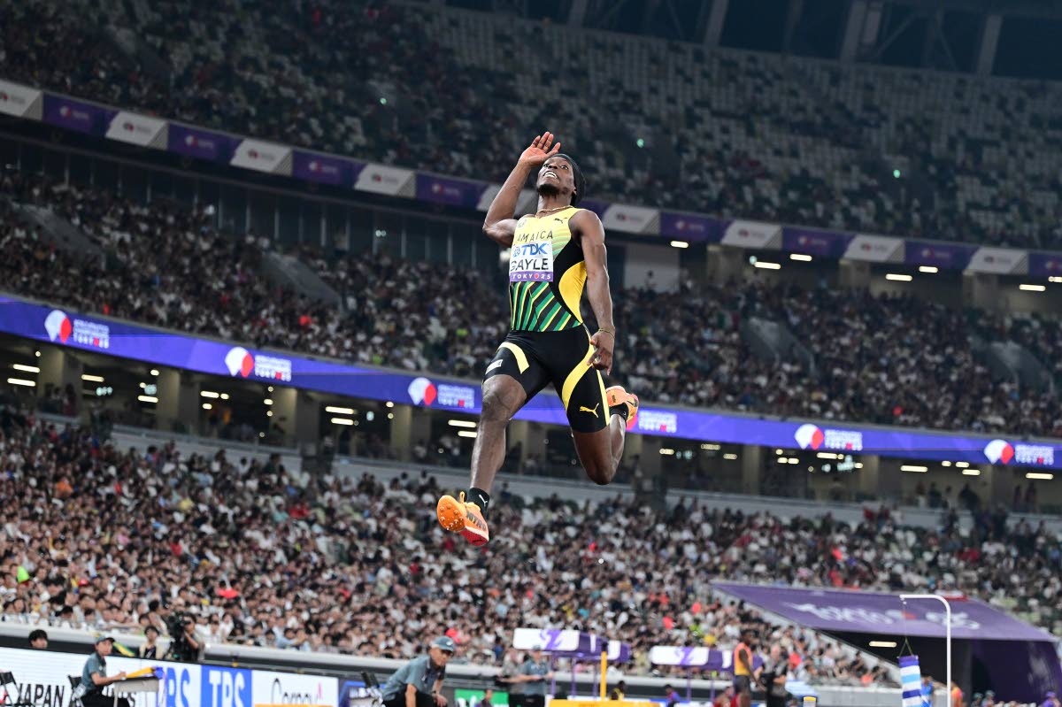 Tajay Gayle on his way to a season’s best 8.34 metres and a silver medal at the World Athletics Championships yesterday.