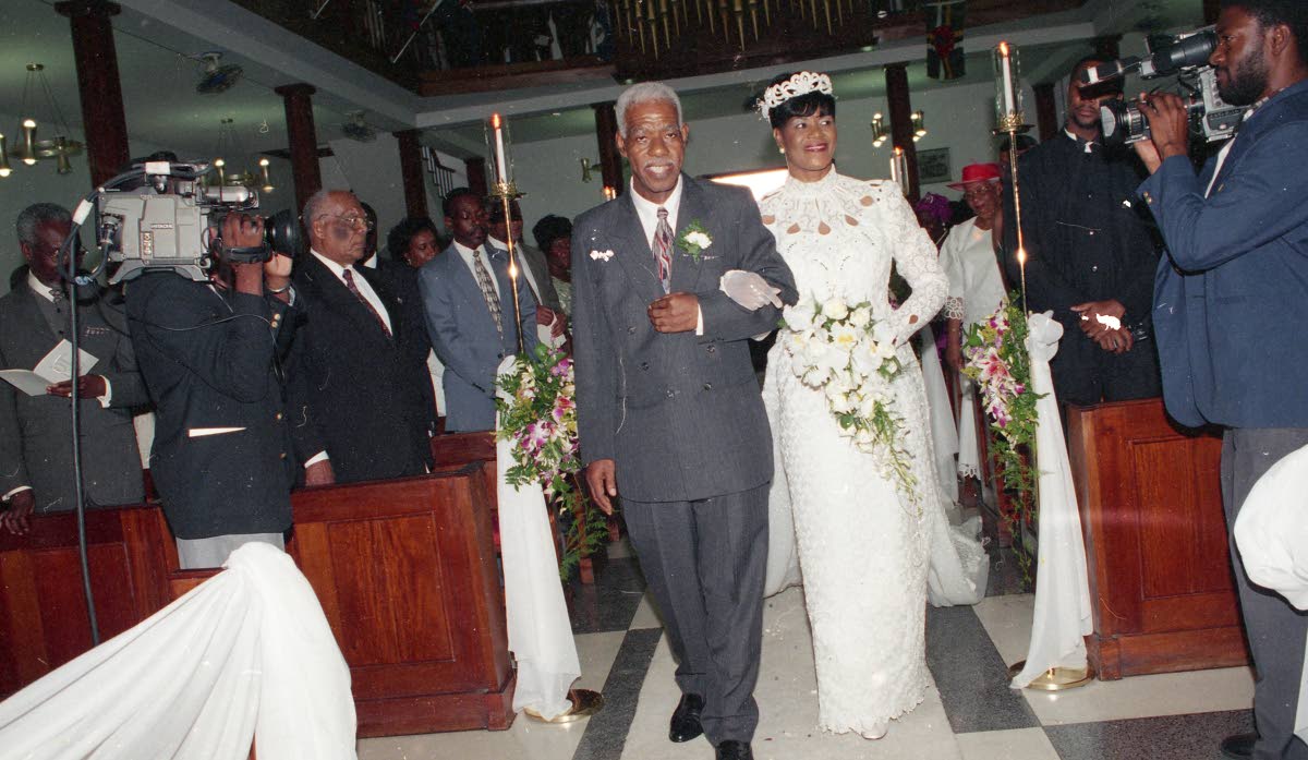 Portia Simpson married business executive Errald Miller in 1998.