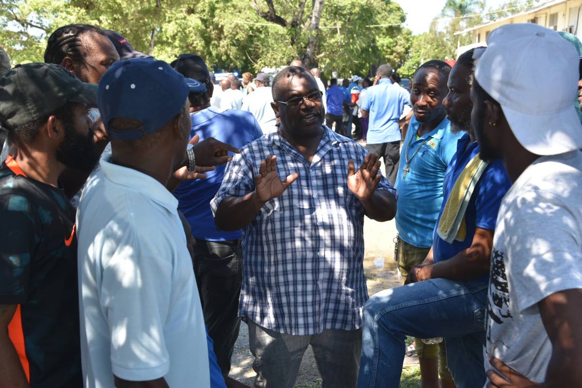 Patrick Forrester (centre), then chairman of the National Council of Taxi Associations’ Business Committee, in discussion with taxi operators plying the Whitehouse to Savanna-la-Mar route in Westmoreland as they withdrew their services on October 24, 202