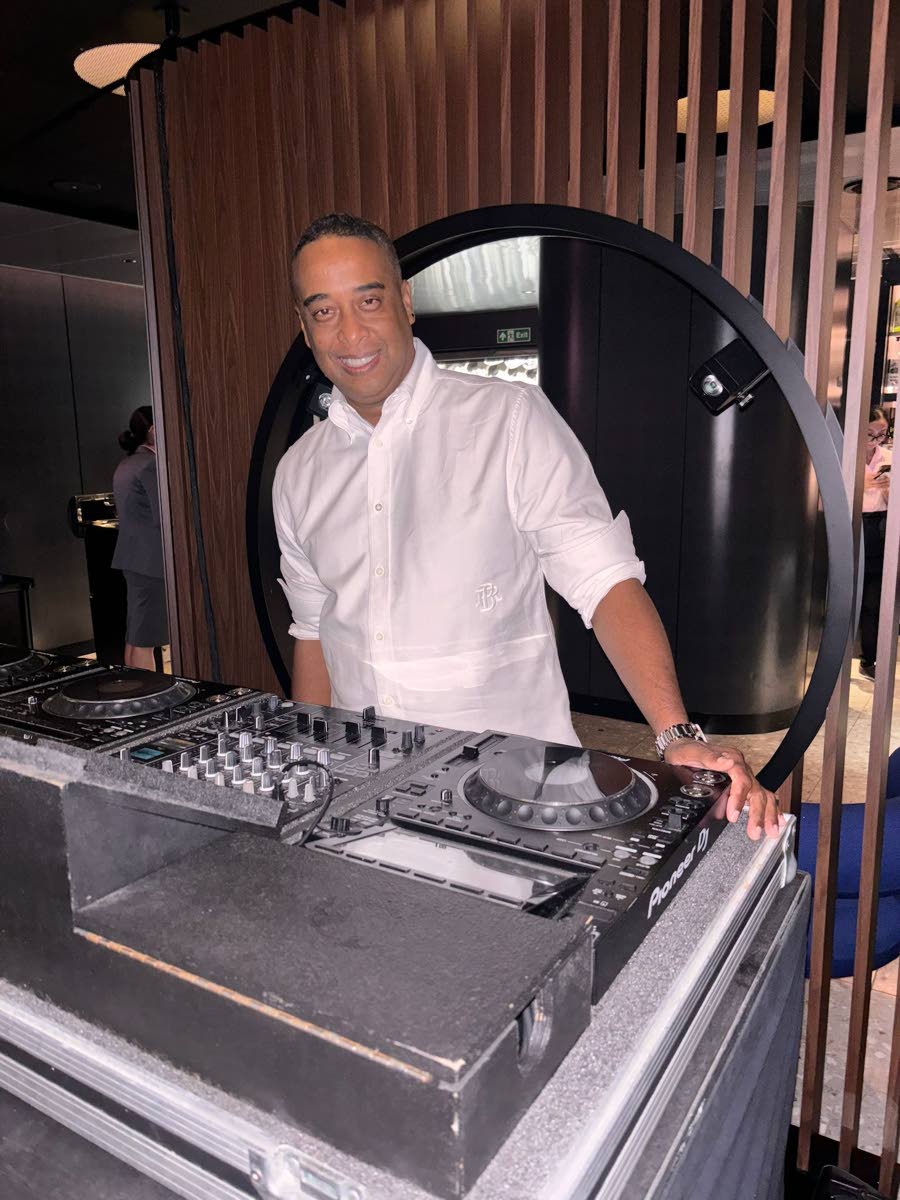 Cool, collected, and always ready to turn up the vibes, Miami-based DJ Timmy HMV smiles for the camera. 