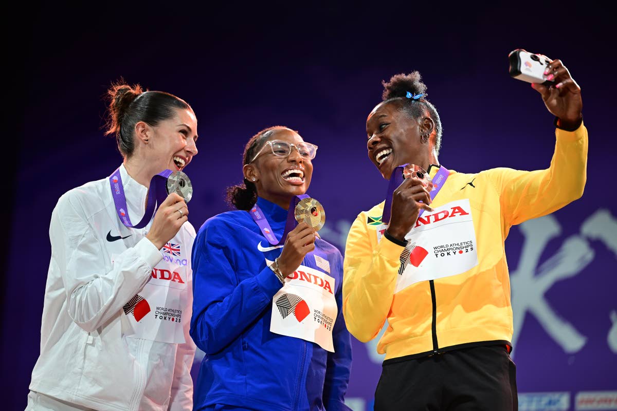 Medallists in the women’s 200 metres pose for a selfie on the podium. From left: silver medallist Amy Hunt of Great Britian, gold medallist Melissa Jefferson-Wooden of the United States and bronze medallist, Jamaica’s Shericka Jackson. The medal ceremo