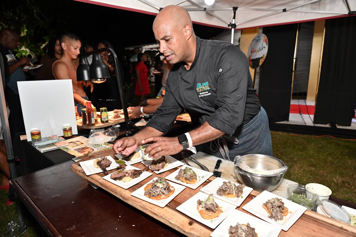 Chef Christian Sweeny adds the final touch to his jonkonoo marinated striploin and jerked lamb rack.
