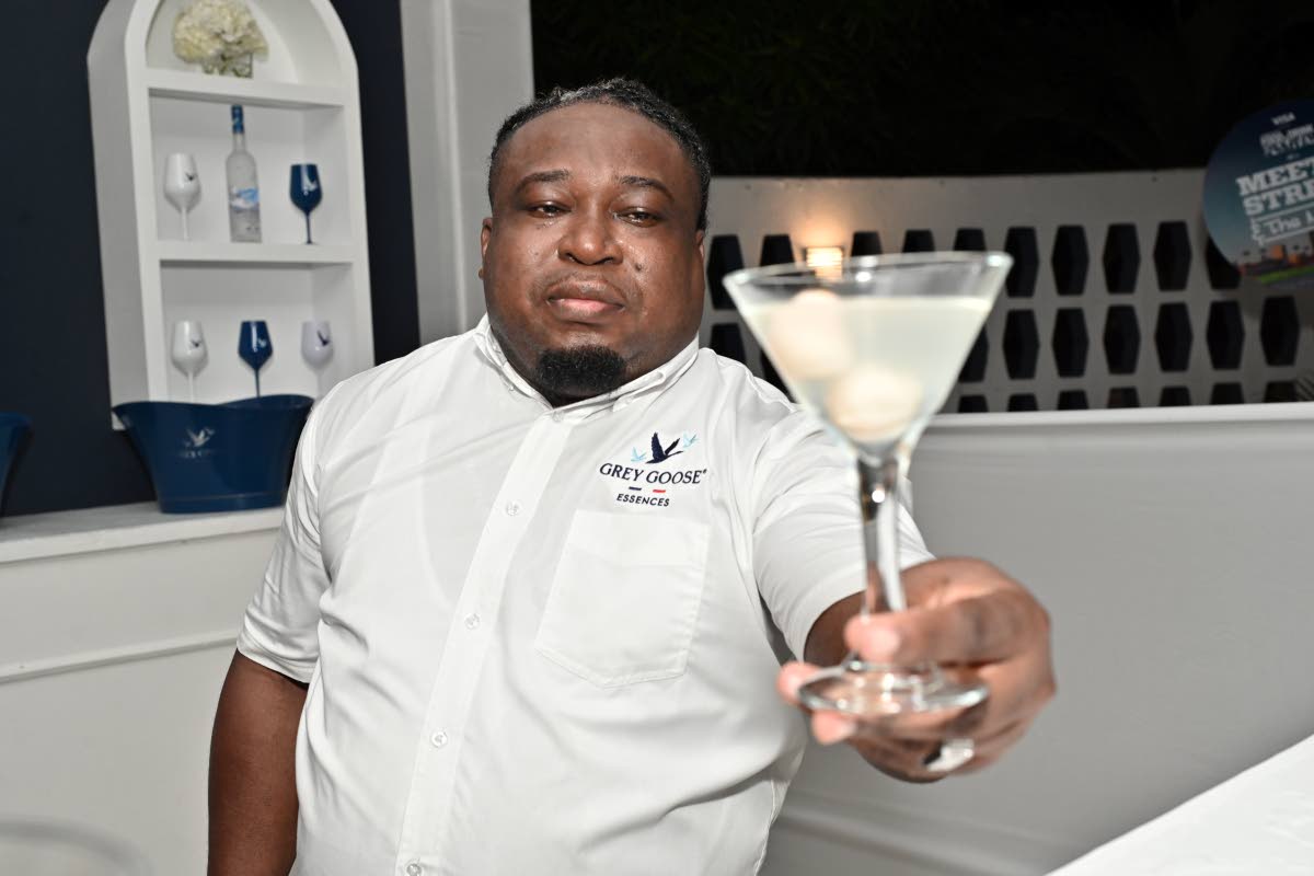 Mixologist Denroy Fisher delivers a lychee martini featuring Grey Goose Vodka.