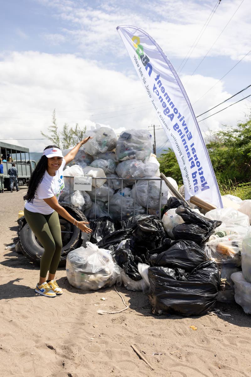 Lauri-Ann Samuels, executive director, National Baking Company Foundation, shows off their trash collection haul from her team’s efforts on International Coastal Cleanup Day 2025 on September 20.