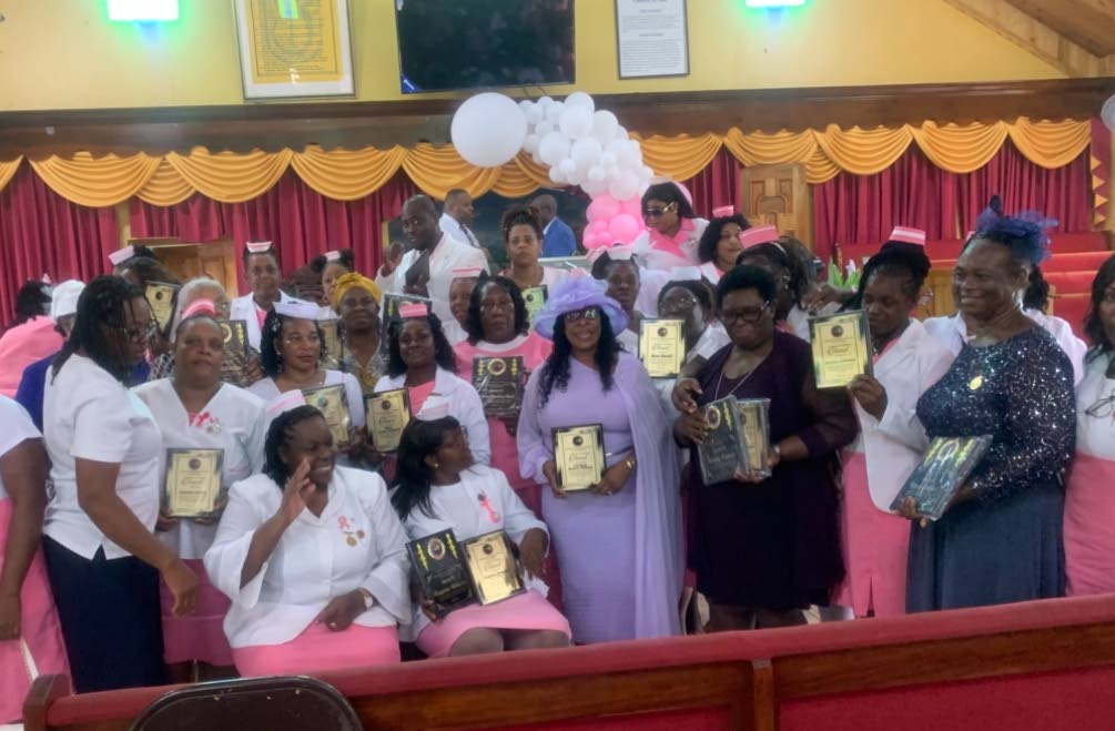 Some of the awardees with their plaques.