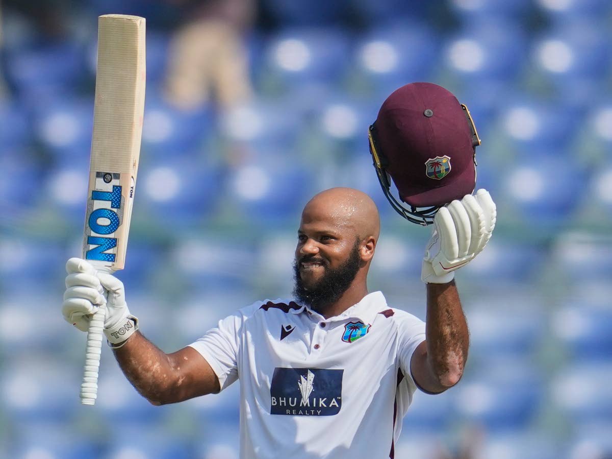 West Indies’ John Campbell celebrates after scoring a century on the fourth day of the second Test match against India at the Arun Jaitley Stadium in New Delhi, India on Monday, October 13, 2025.