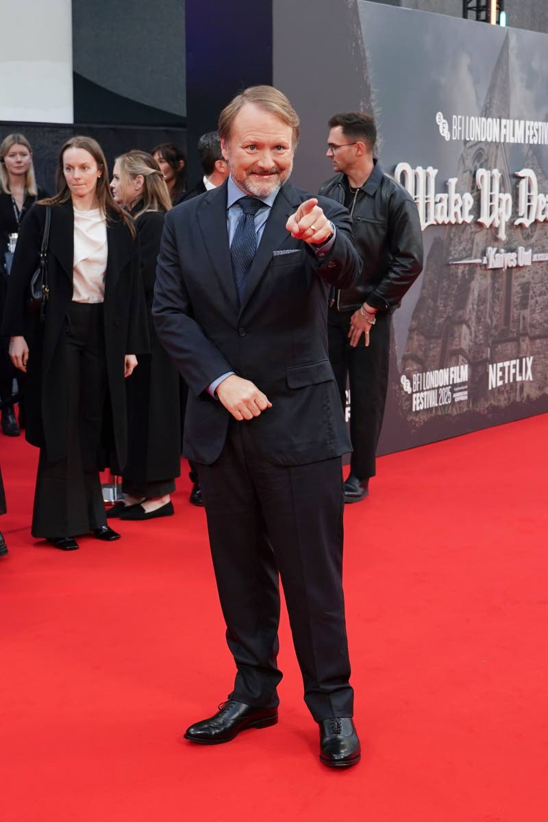 Director Rian Johnson poses for photographers upon arrival at the premiere of the film ‘Wake Up Dead Man: A Knives Out Story’.