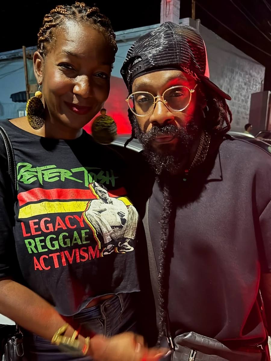 Niambe Tosh (left), chairperson of the Peter Tosh Foundation and daughter of the legendary musician, shares a snap with reggae singer Tarrus Riley at this week’s Tuesday Service, held on Lancelin Avenue in St Andrew, which paid tribute to her father.