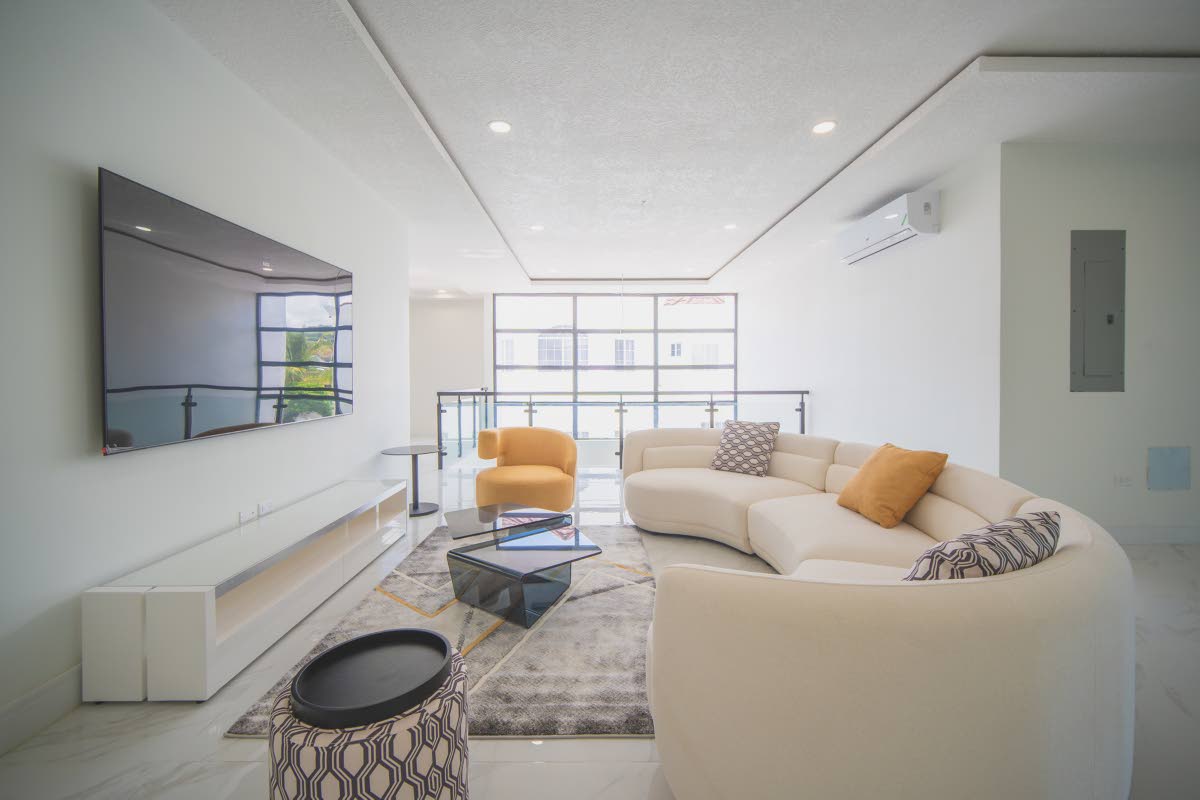 The upstairs family room overlooks the living room directly below.