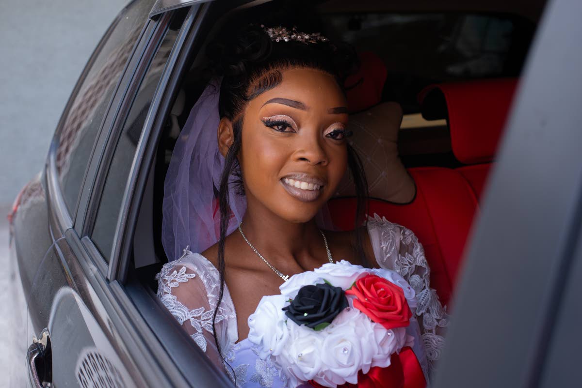 Samantha smiles for the camera as she prepares to meet her groom at the altar.