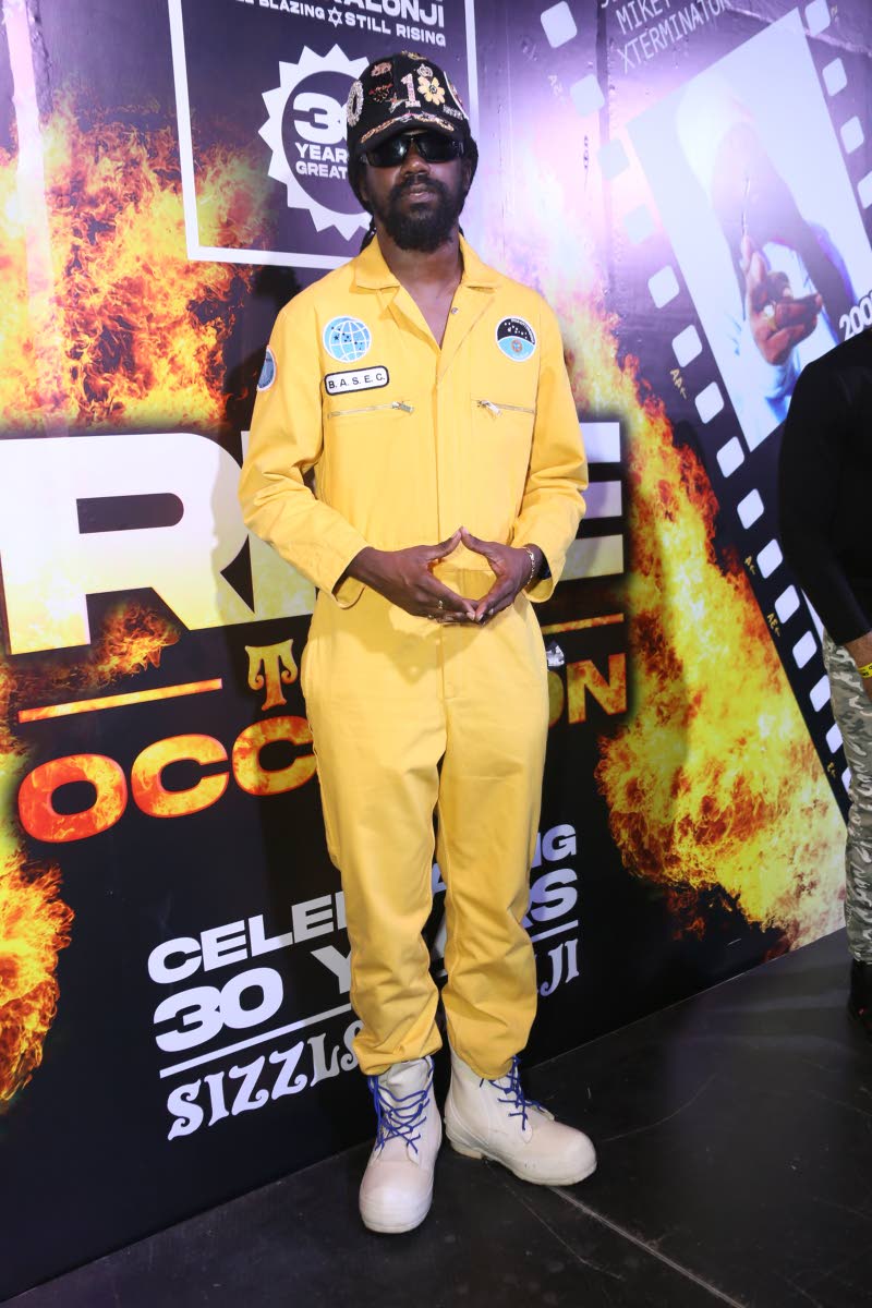 Runkus poses backstage for the camera before hitting the stage to perform ‘Kettle Drum’ by his father, late veteran reggae artiste Determine.