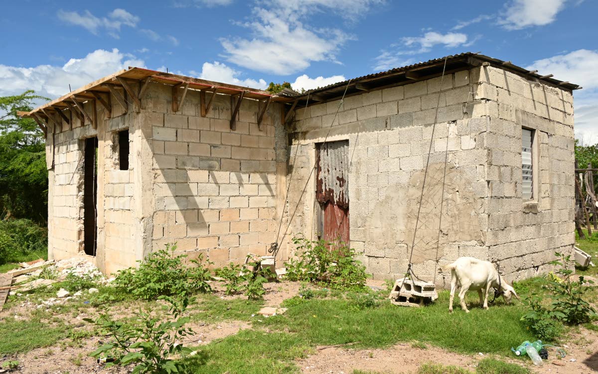 
A home in Parottee, St Elizabeth, with lengths of rope across the roof, secured to building blocks on the ground to help keep it in place when Hurricane Melissa hits.