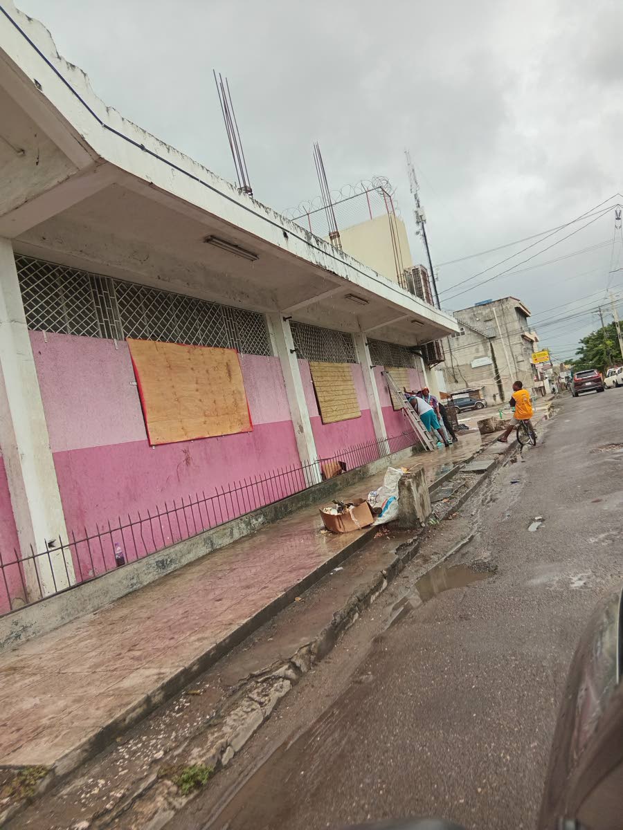 Businesses being battened down on Young Street in Spanish Town, St Catherine on October 26, 2025. 