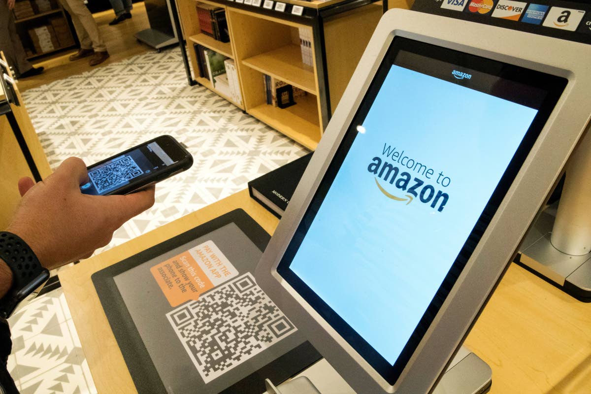 A shopper uses the Amazon app to pay for his purchase at the Amazon 4-star store in the Soho neighbourhood of New York, in this September 27, 2018 photo.