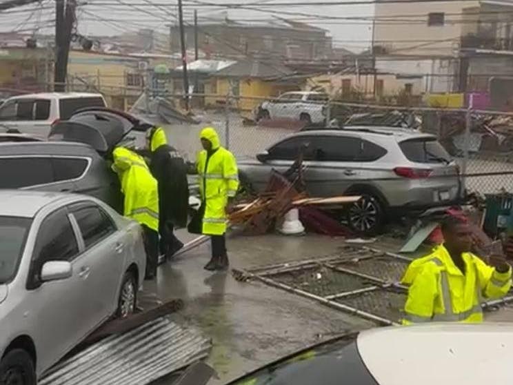 Police personnel at the Black River Police Station in St Elizabeth accessing damage to the station during the passage of Hurricane Melissa on October 28, 2025.