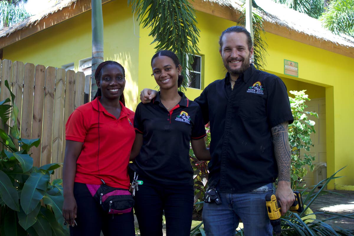 General curator at Hope Zoo, Joey Brown, poses with team members  Shaneek Lewis (left), animal care supervisor, and Dr Szarianne Khan (centre), veterinarian.
