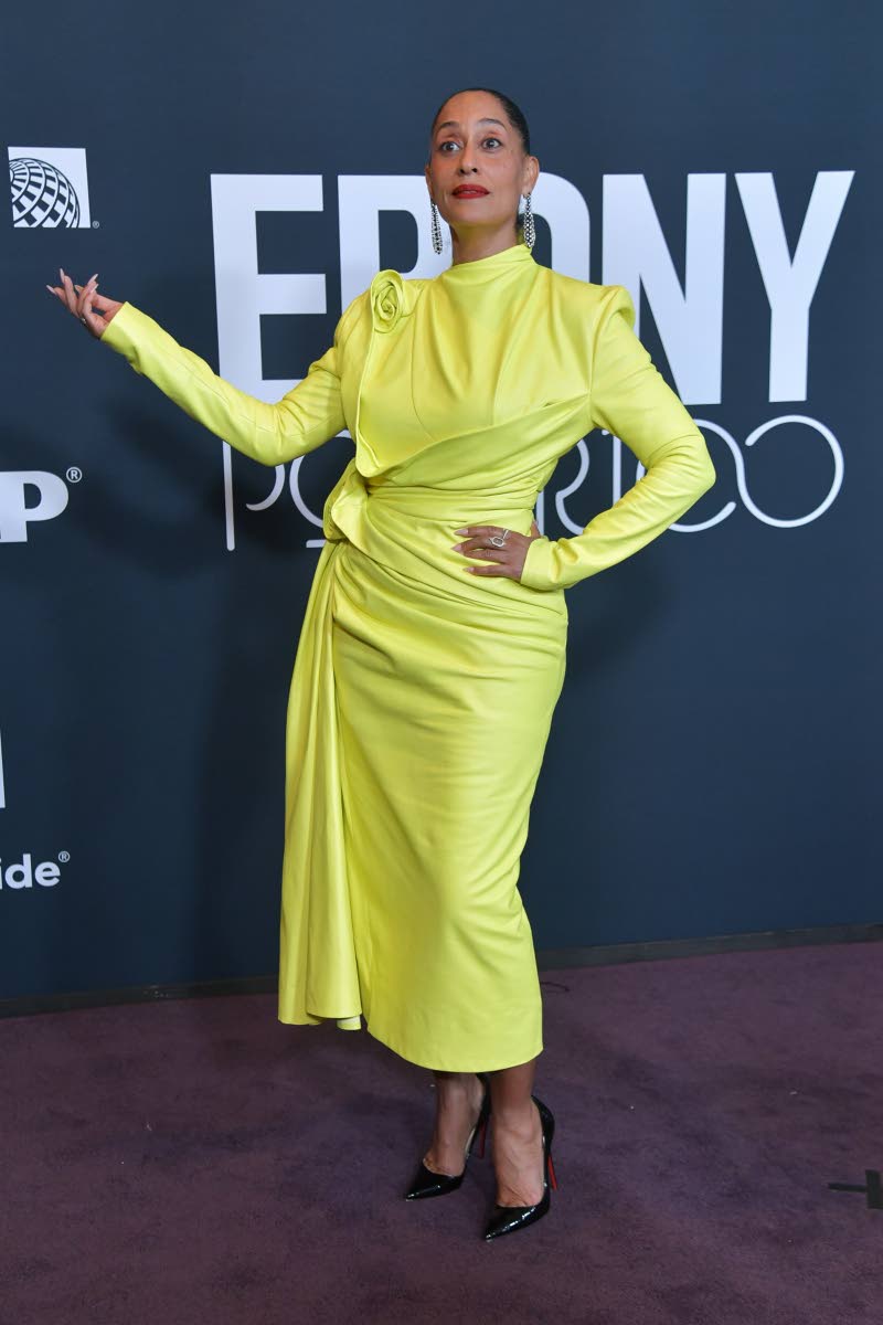 Tracee Ellis Ross in acid-yellow draped leather Mugler.