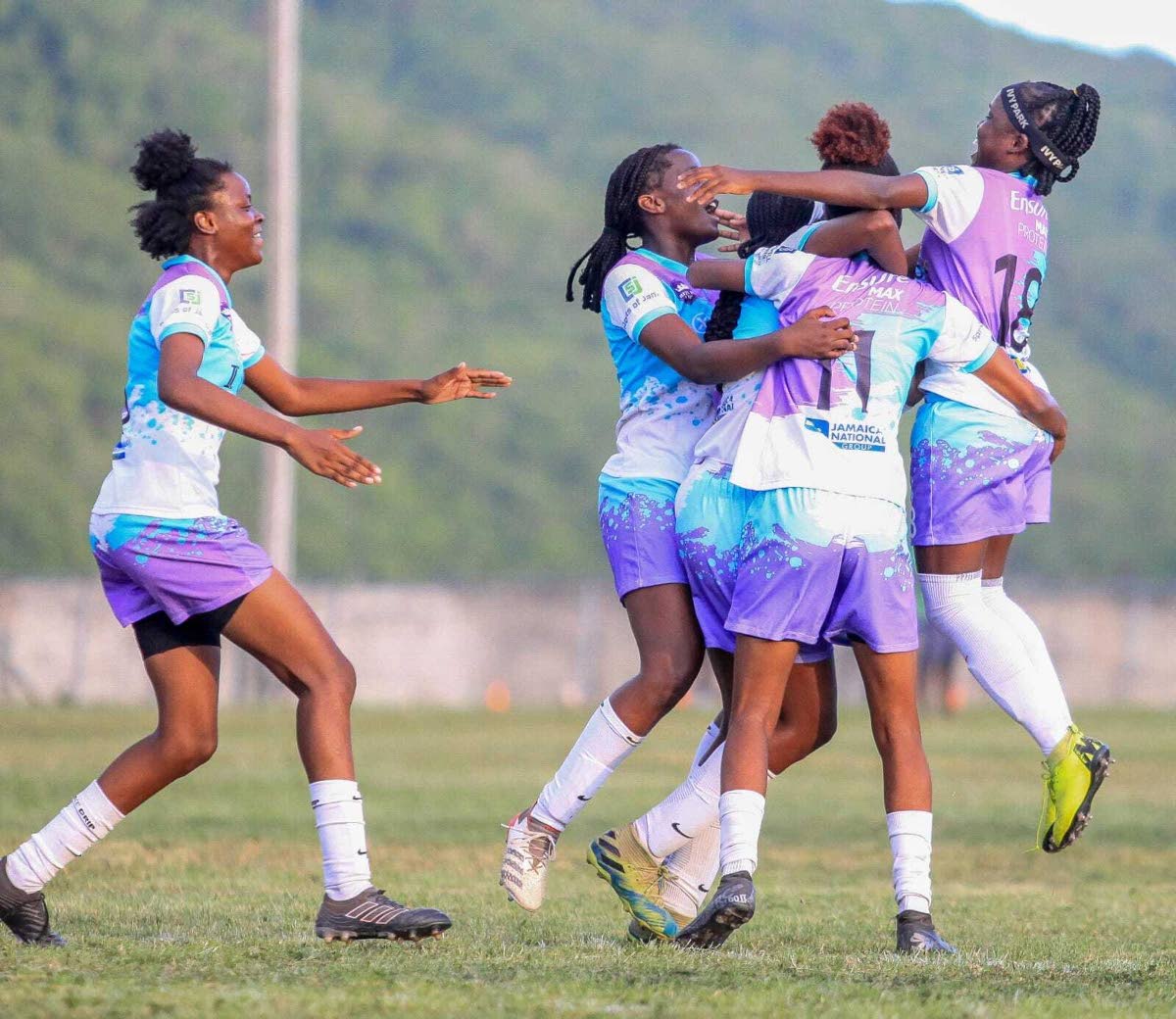 Reinas Academy players celebrate after scoring a goal at the 2023 Reinas Cup competition.