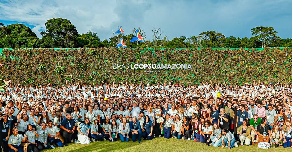 President of Brazil Luiz Inácio Lula da Silva, poses for a photograph with COP30 volunteers at the City Park, Belém