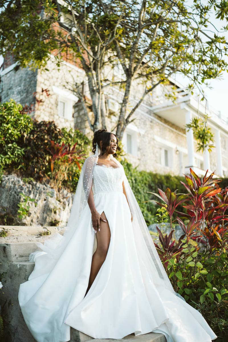 A vision of beauty and light, the bride stuns in her custom Sara E Bridal gown.