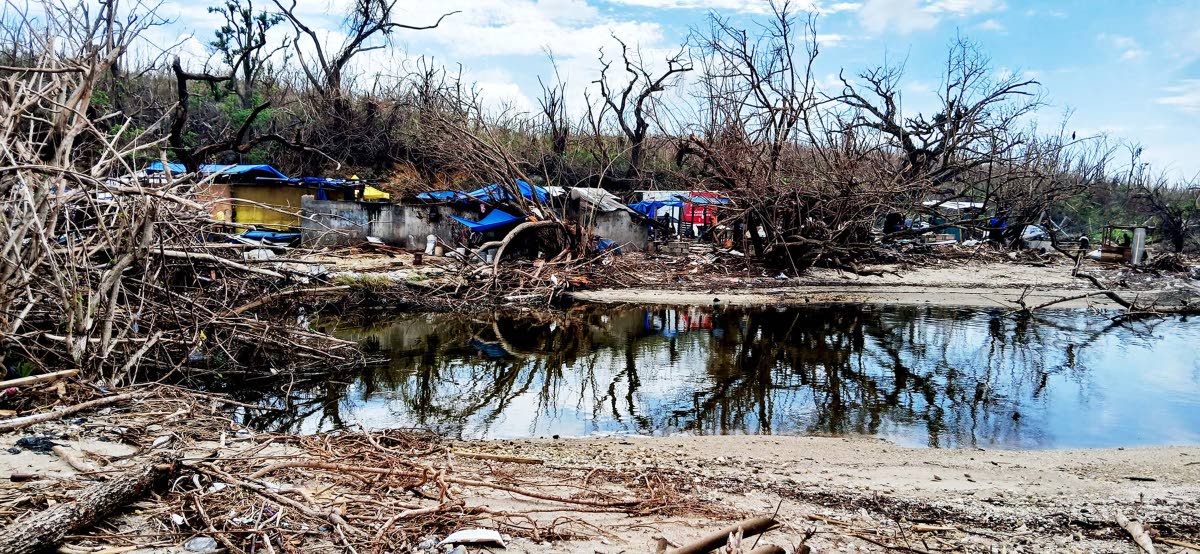 Structures in the distance stand on the sands of a lake in St Elizabeth after the passage of Hurricane Melissa.
