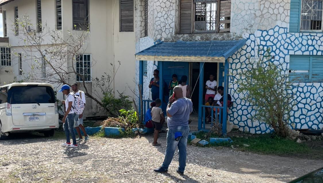 Residents making use of the Starlink at the Montego Hills Police Station.