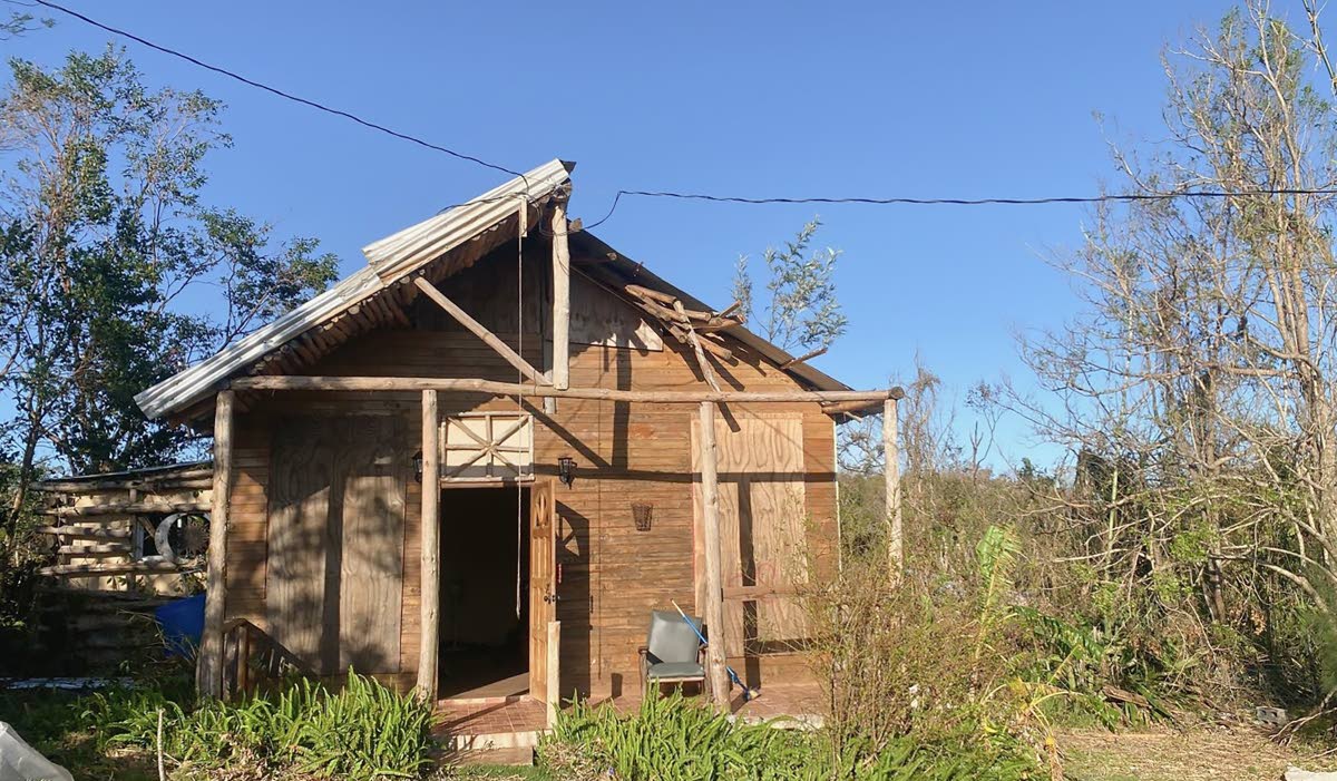 A beloved cottage bearing the marks of the hurricane.