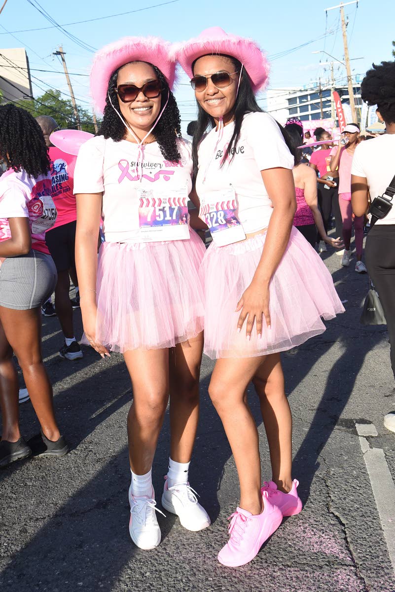 Below: Shantell Dixon (left), sales support officer at Sagicor, and Toni Campbell, senior compliance manager at Scotiabank, step out in matching pink cowboy hats.