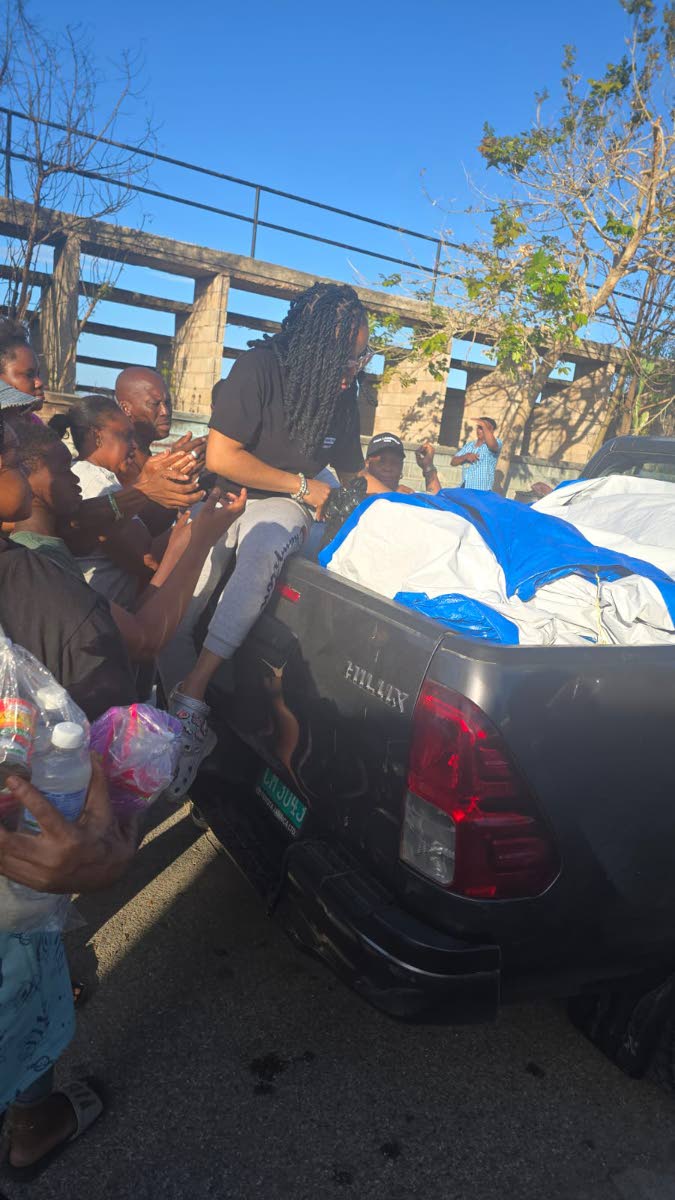 Sonya Hall, administrative and training coordinator at the Caribbean Shipping Association, distributes relief supplies to residents in communities impacted by Hurricane Melissa as part of the maritime sector’s continued support for national recovery effo