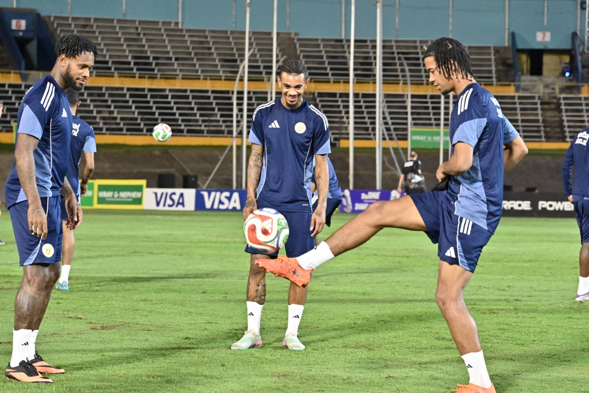 Curacao players warm up ahead of their final training session ahead of today’s World Cup Qalification game against Jamaica’ Reggae Boyz at the National Stadium last night.