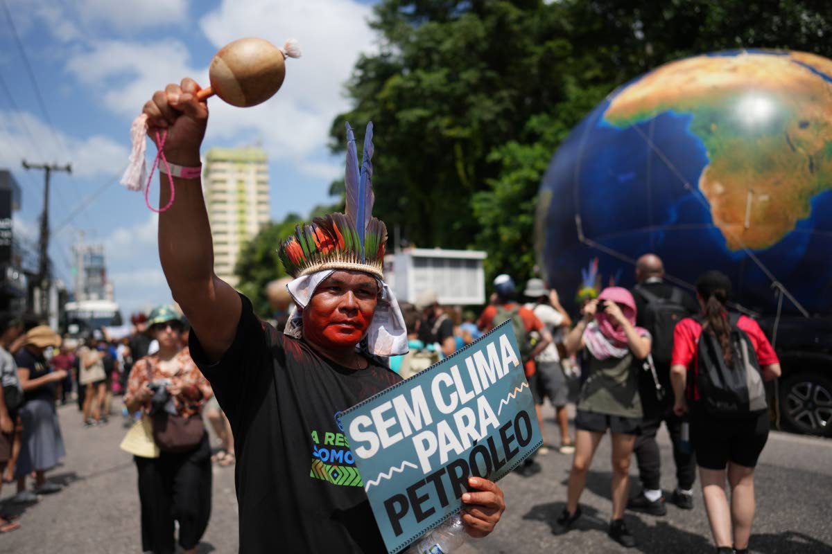 Indigenous activists participate in a climate protest during the COP30 UN Climate Summit in Belém, Brazil. 