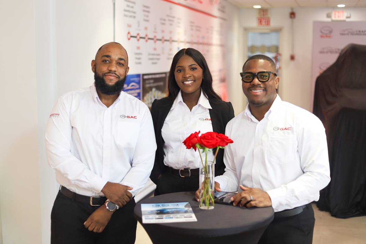 GAC Jamaica Sales Executives, left to right, Akeem Campbell, Daina Blackburn and Akeema Willis, stand poised at GAC’s recent official launch event in Kingston.