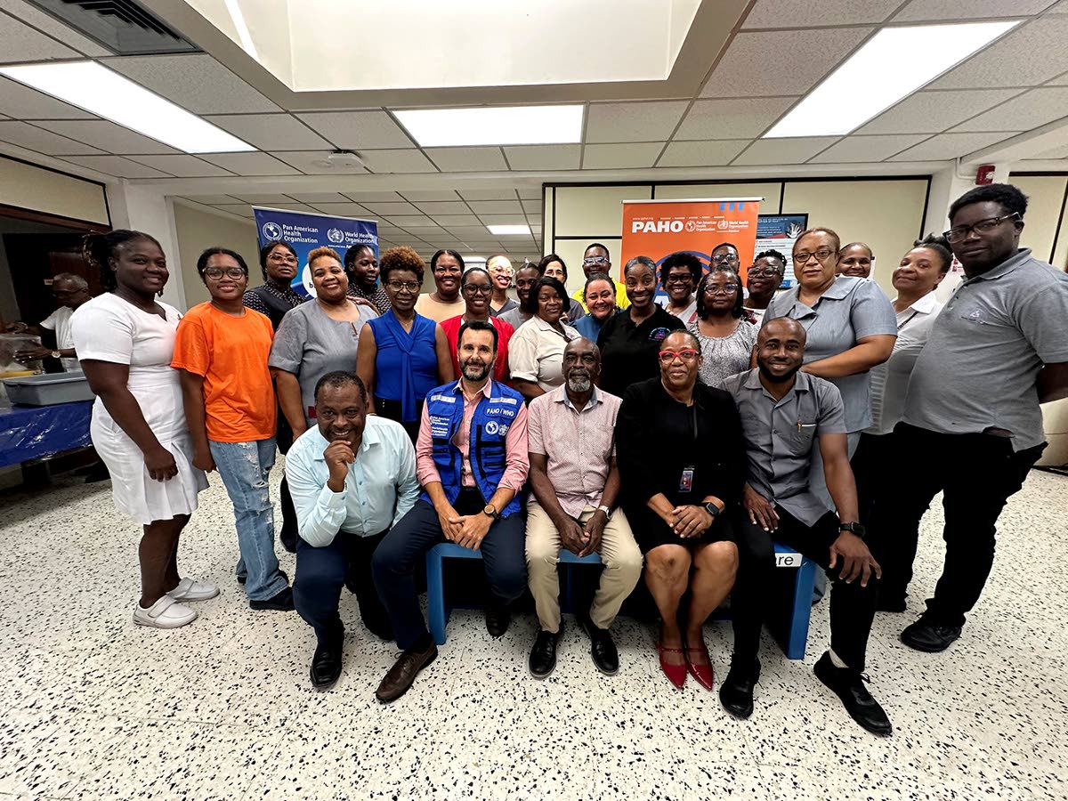 A team of healthcare workers from the Ministry of Health and Wellness and the South East Regional Health Authority at their psychological first aid training in Kingston on November 12.
