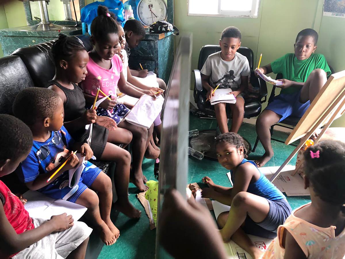 
In this transformed salon, in Lima, St James, students work side by side, a reminder that education continues even when classrooms are lost.