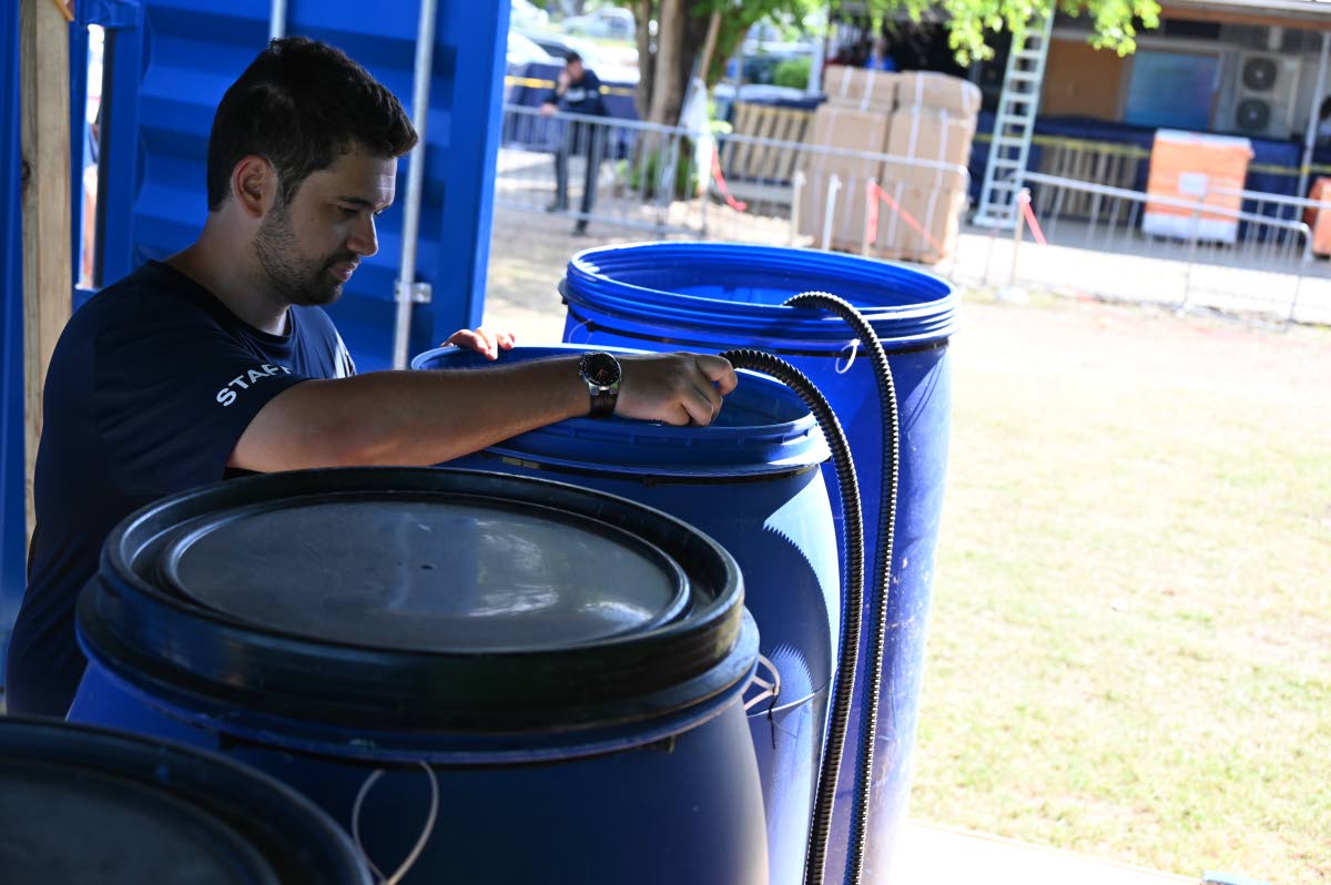 
Using electrochlorination, Operation Blessing’s Bruno Dias supervises the transformation of salt water into disinfecting bleach.