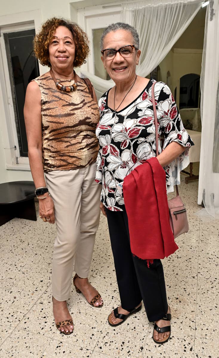 Fae Ellington (right), Jamaican media personality, shares a moment with Diane Edwards, director of the Professional Services Unit, Mona School of Business and Management.