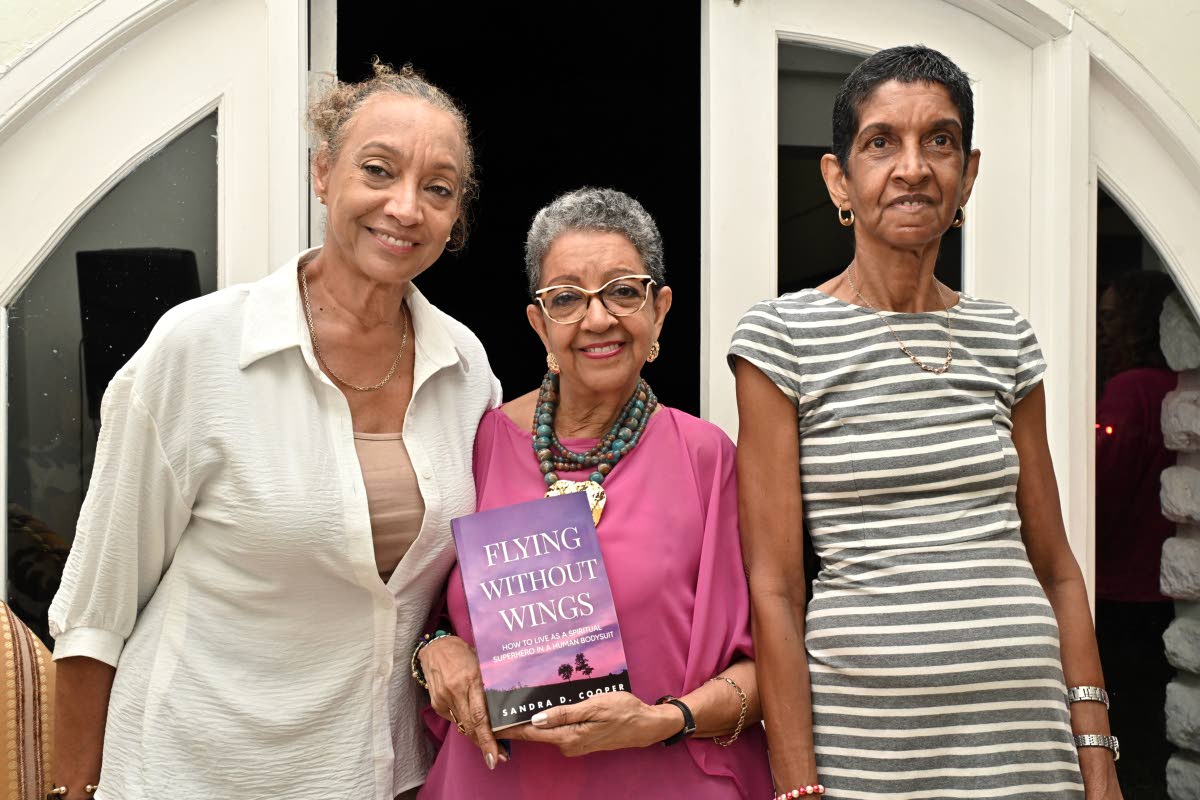 There’s no greater feeling than celebrating a sibling’s milestone, with first-time author Sandra D. Cooper (centre) flanked by her sisters, Celia McCreath (left), and Sherille Hamilton.