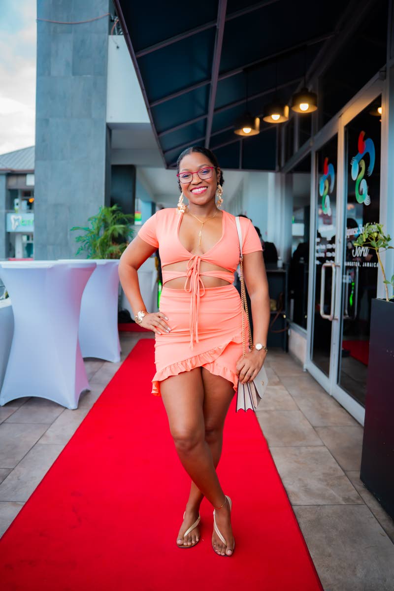 Dr Rikki Lee Hunter says yes to a coral cut-out dress for brunch.