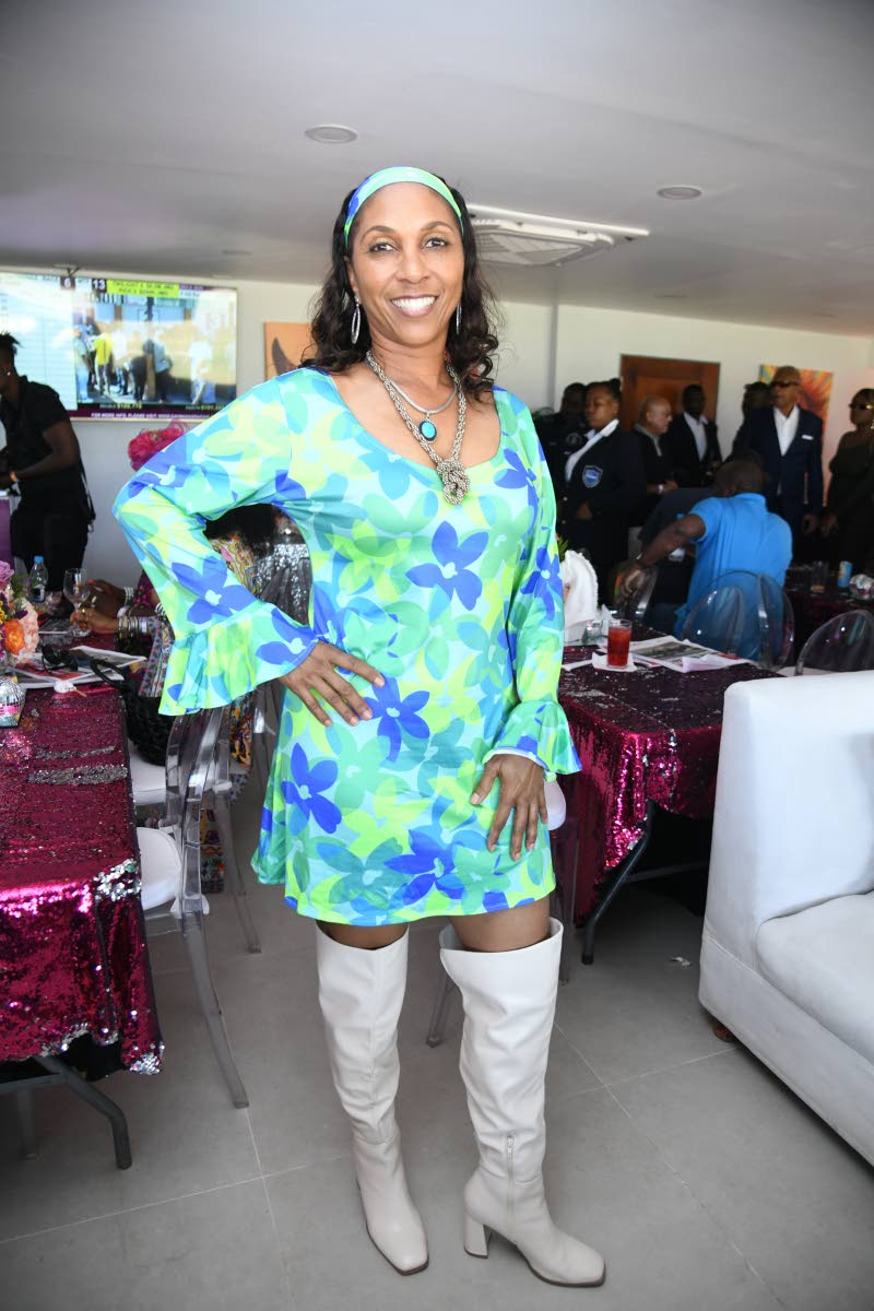 Above: Dr Trudi Stewart-Gaynor is positively groovy in her flower-power dress paired with statement knee-high boots.