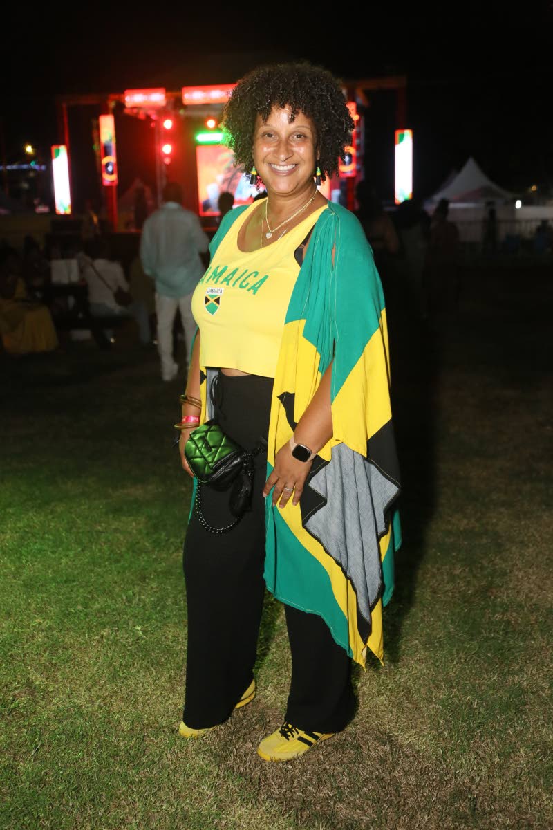 Smiling for our lens, Mary Pinelli, sales manager, rocks Jamaican colours in solidarity with Hurricane Melissa victims.