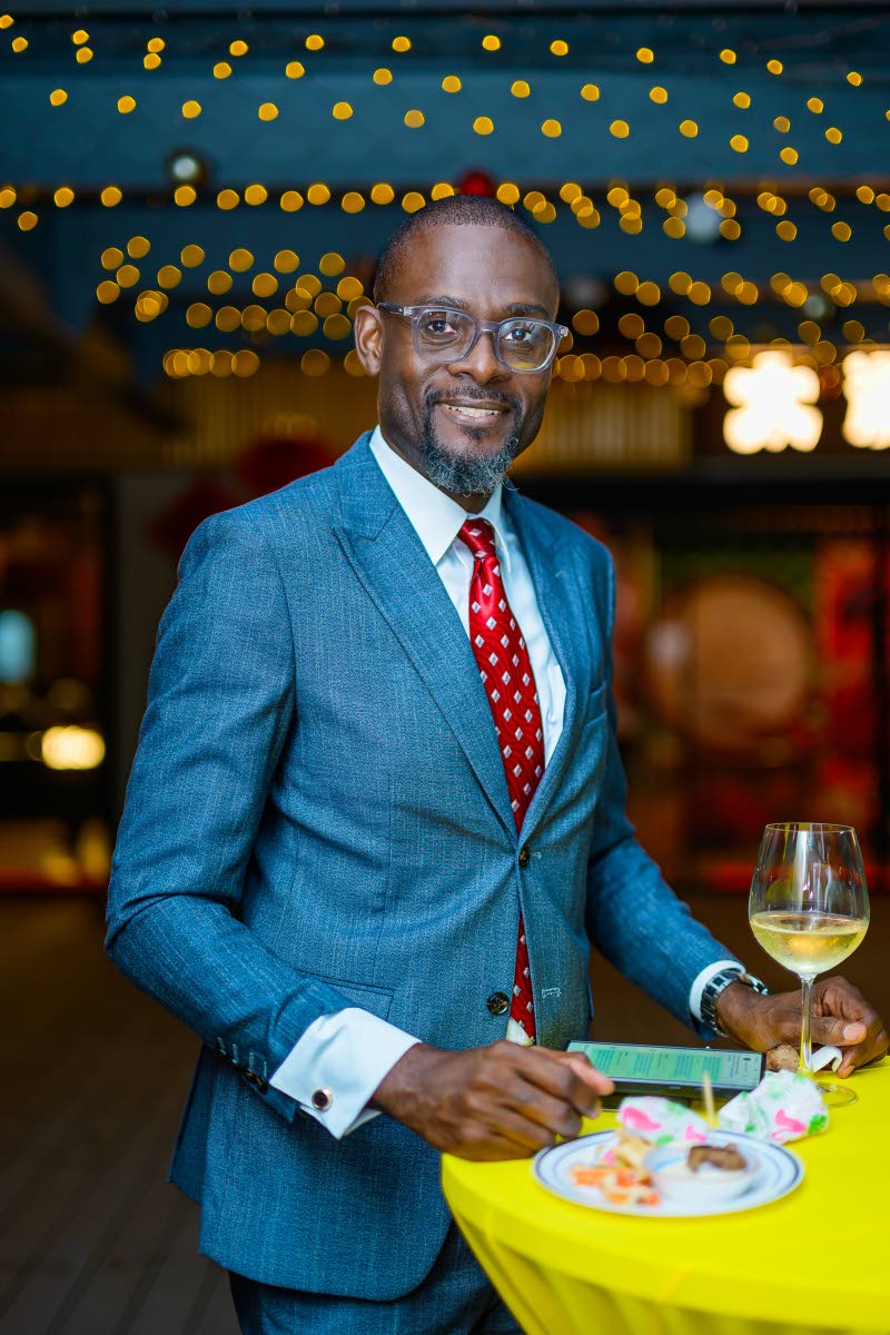 Oral Heaven, centre director for Scotia Private Banking, takes in the ambience at Mezza Luna’s grand opening.