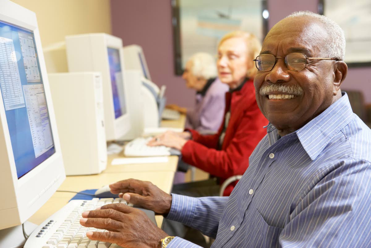 Representational image of an elderly gentleman working on a computer.