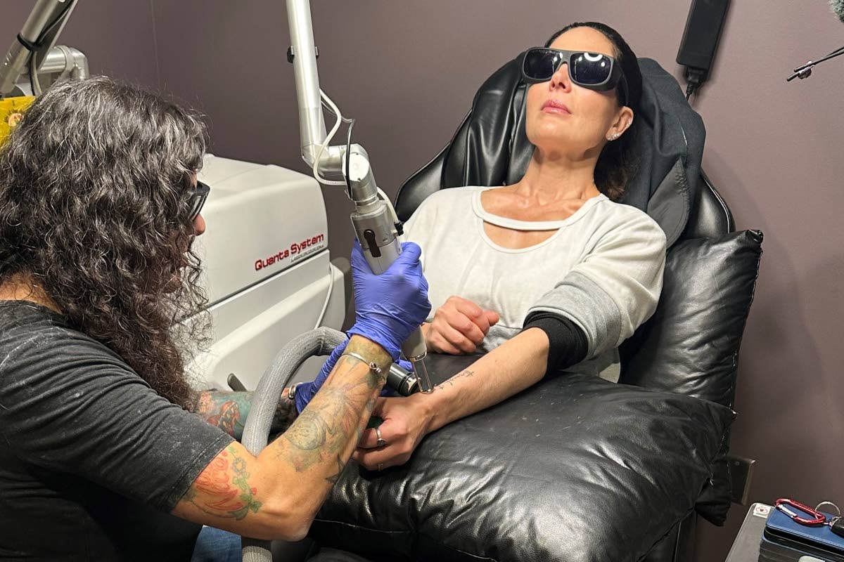 Tracy Herrmann has one of her tattoos removed by Chroma Tattoo Studio Laser Tattoo Removal owner Jaime Howard on November 19, 2025, in West Bloomfield, Michigan.