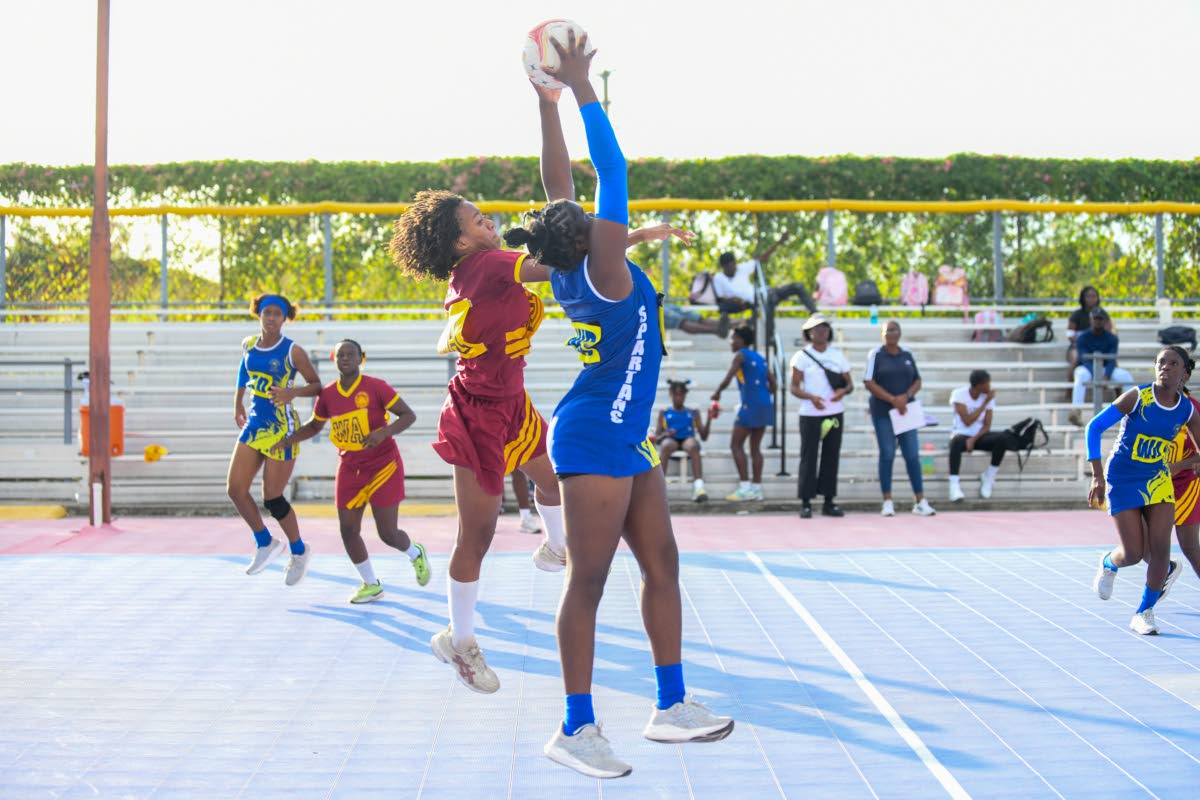 Photos by Matthew McKoy/Photographer 
Wolmer’s Girls’ School’s Zoi Chin (left) challenges Jose Marti’s Christianna Kirland during an ISSA Urban Netball semi-final at the Leila Robinson Courts on Thursday.  