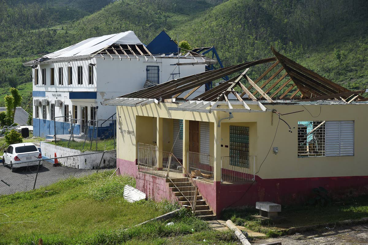 Damaged roofs of Lewisville Police Station and post office, blown away by Hurricane Melissa.