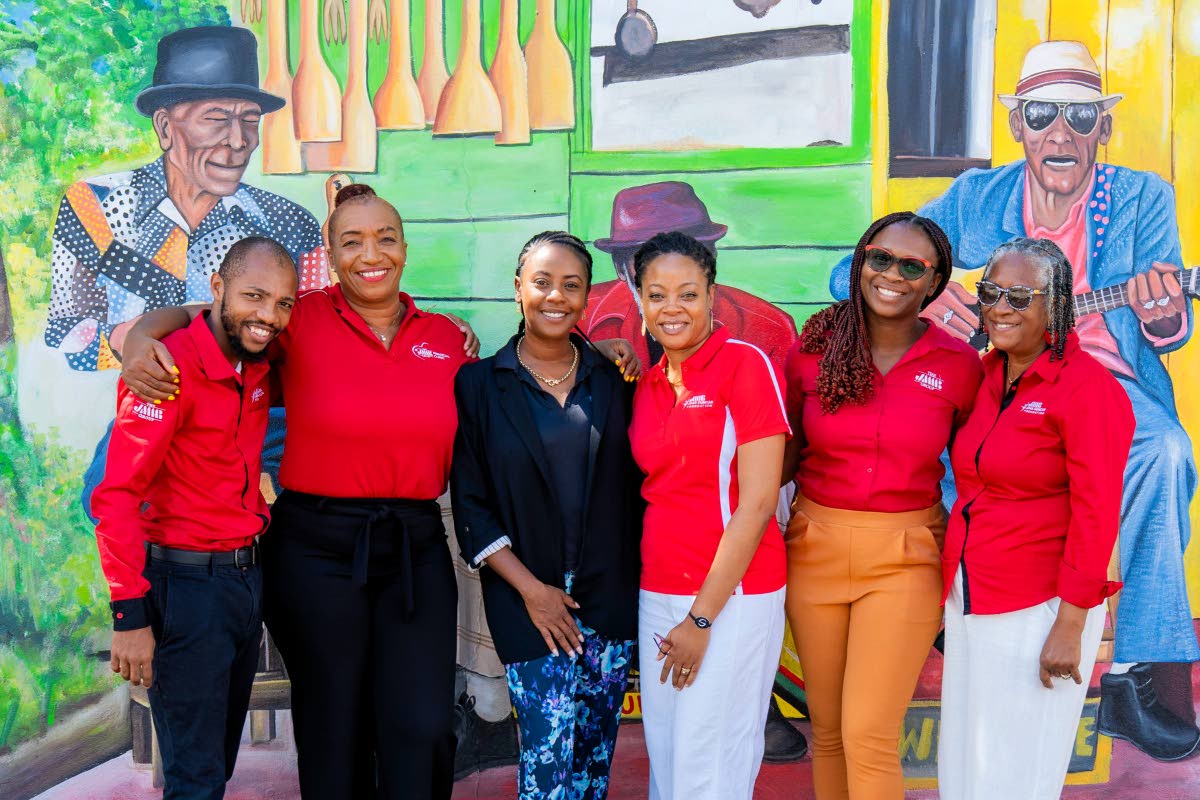 JMMB team members with Emprezz Golding, CEO of Talk Up Yout, following the CHAMP Parenting Conference.