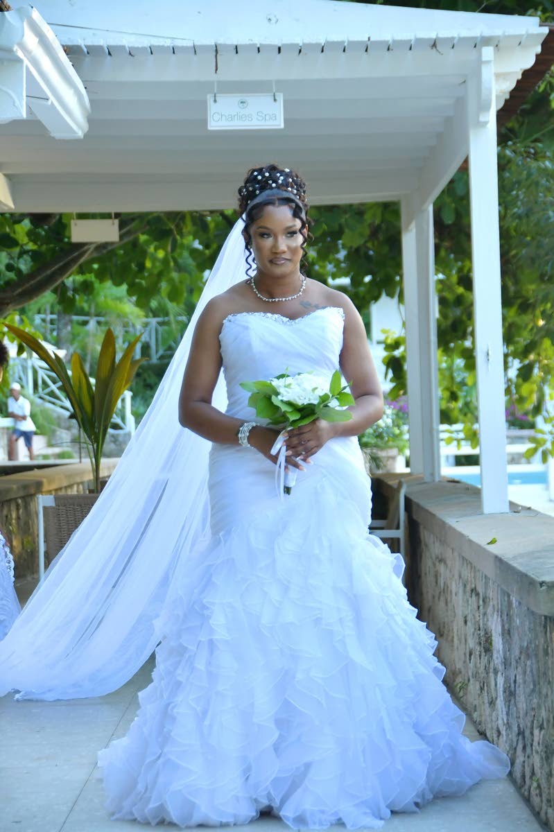 Carsia said yes to an off-the-shoulder mermaid dress by Bridal Gowns by Neita.
